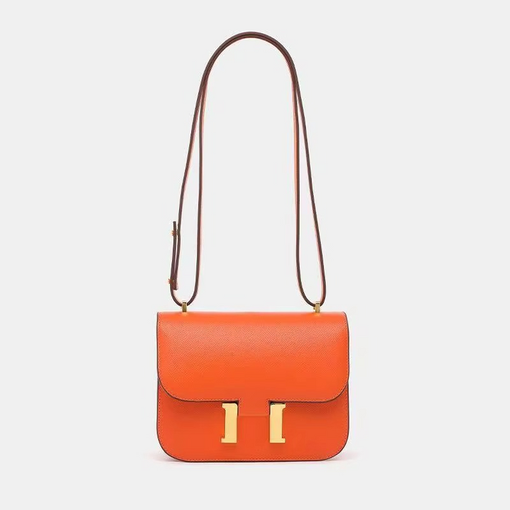 Bolso pequeño de mujer para el hombro, con patrón tropical vibrante, ideal para días soleados.