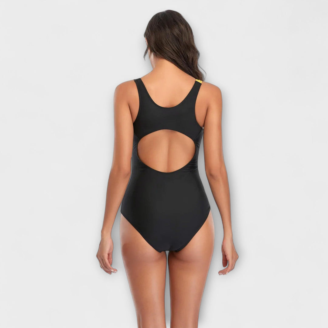 Traje de baño bicolor con rayas diagonales para mujer, estilo deportivo, espalda abierta. Para nadar en el mar.