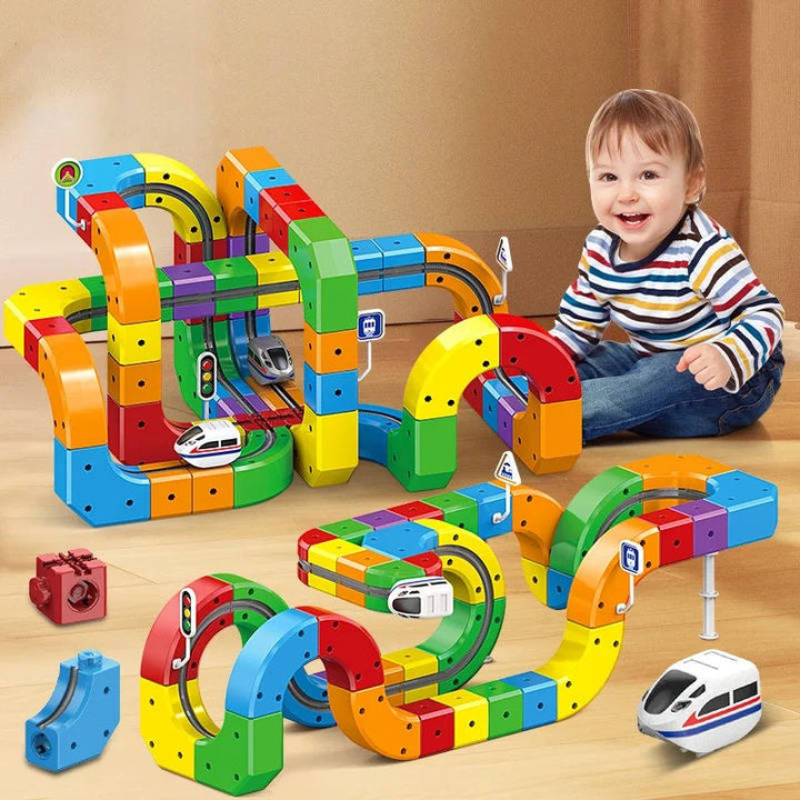 Juguete de construcción modular con pistas de tren magnético, fomenta creatividad y habilidades motoras.