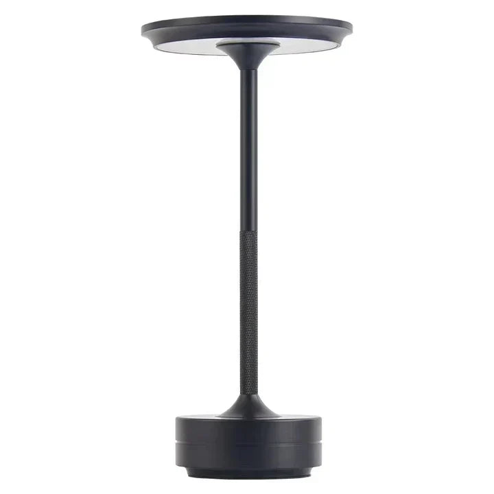 Lámpara LED compacta de mesa, inalámbrica y regulable, para una luz ambiental elegante y funcional.