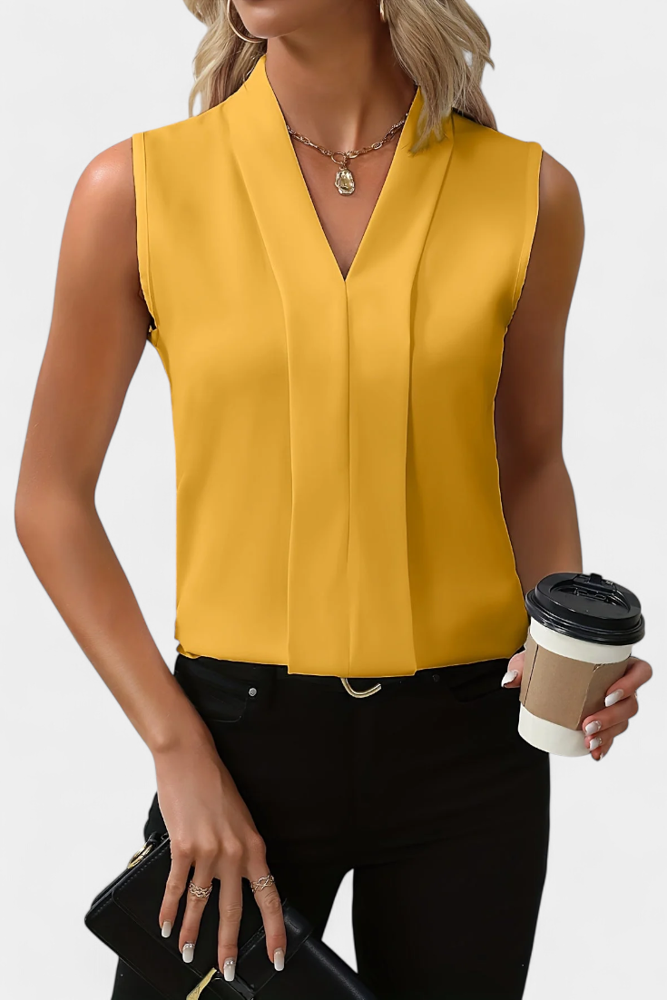 Top de mujer sin mangas, escote V. Blusa fluida y cómoda, perfecta para moda casual o eventos de verano.
