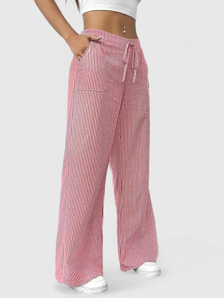 Pantalón ancho amarillo vibrante de mujer. Tejido ligero, cintura ajustable y transpirable.