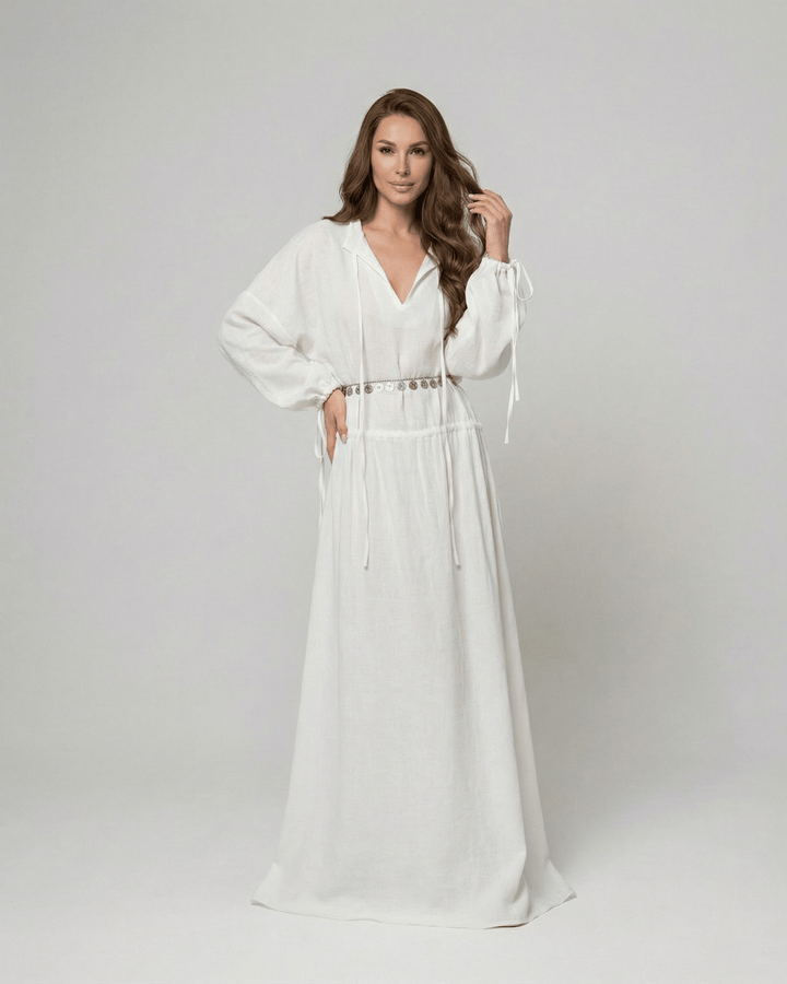 Vestido largo blanco Elara para mujer, diseño maxi fluido con manga larga. Estilo ajustable y elegante de verano.