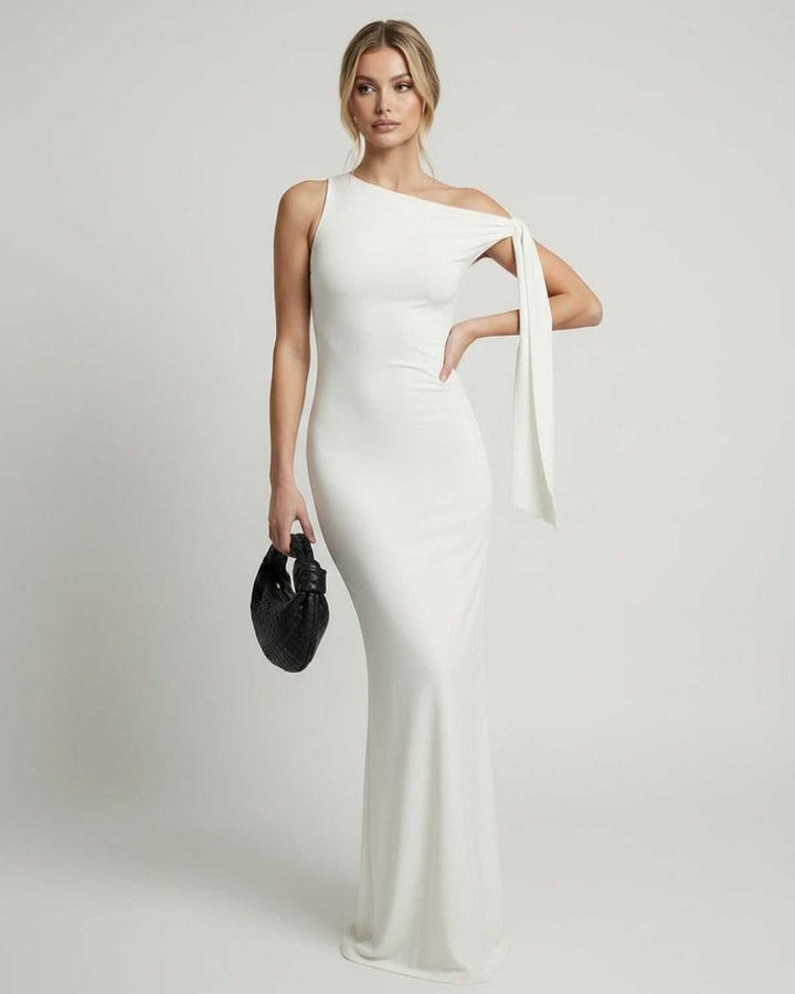 Vestido de noche blanco de un hombro, diseño moderno y elegante para mujer en fiestas exclusivas.