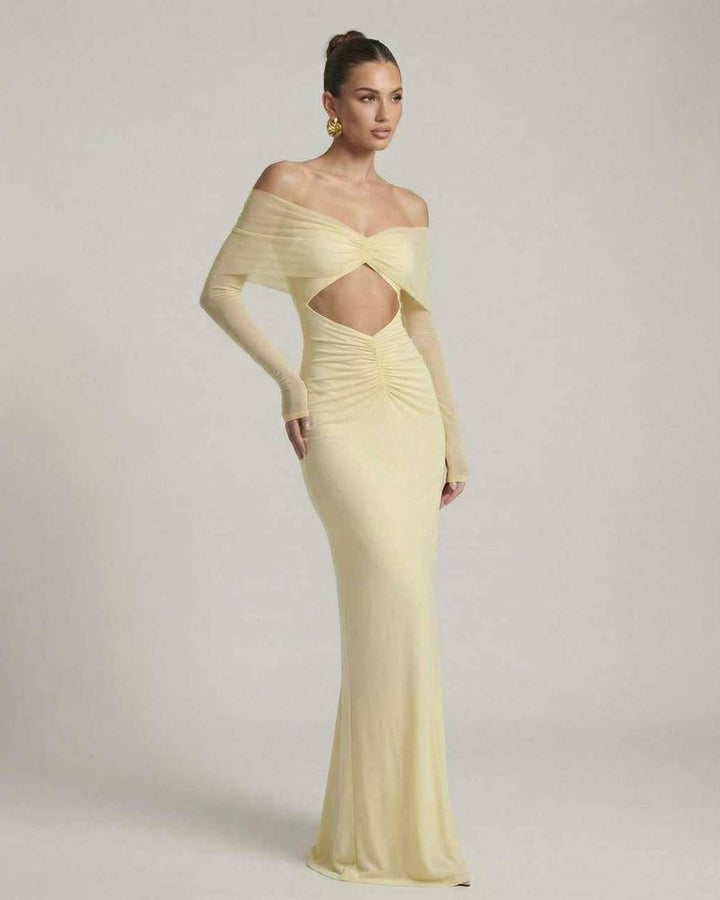 Vestido de mujer amarillo vibrante, estilo maxi para noche o eventos especiales. Mangas de malla.