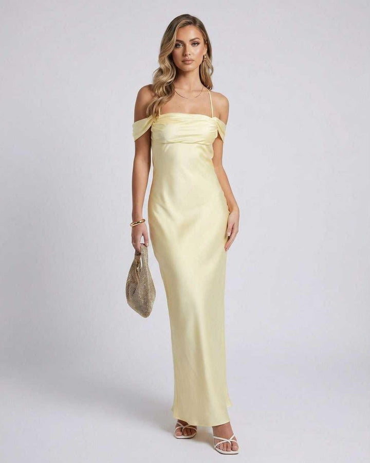 Vestido maxi Elara amarillo para mujer, diseño elegante con hombros descubiertos, ideal para fiestas de verano.