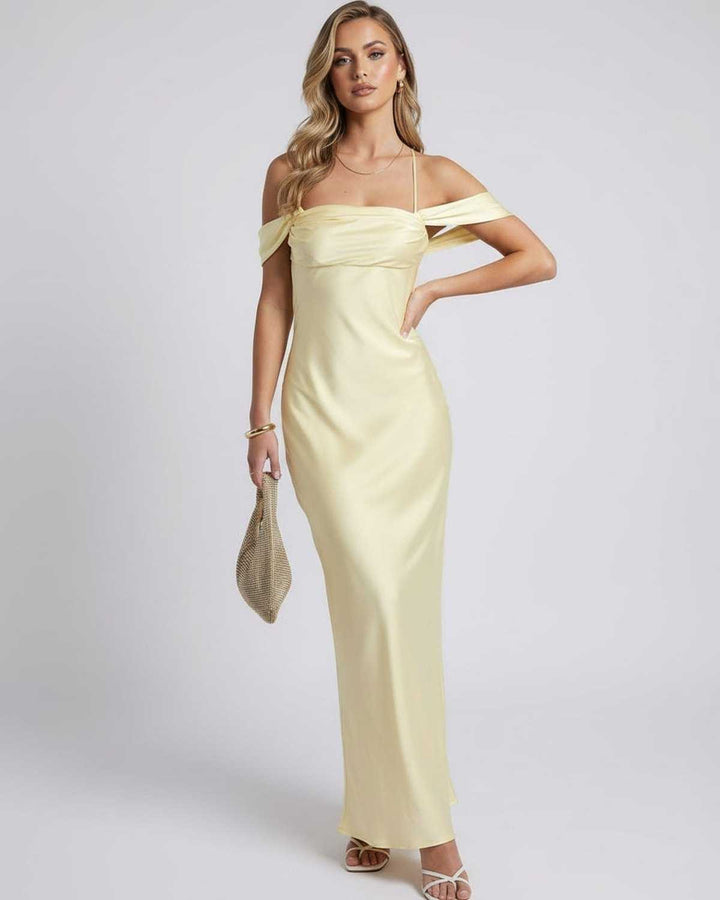 Vestido maxi amarillo brillante Elara para mujer, hombros descubiertos, perfecto para días soleados y celebraciones.