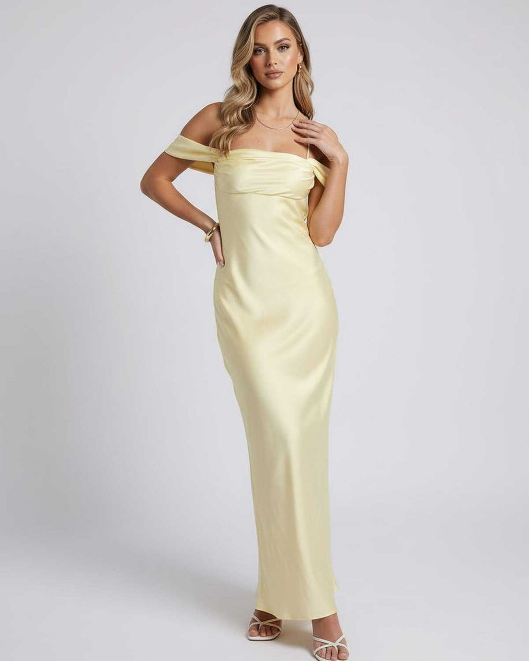Vestido de noche amarillo vibrante para mujer, corte maxi y hombros descubiertos, ideal para un estilo inolvidable.