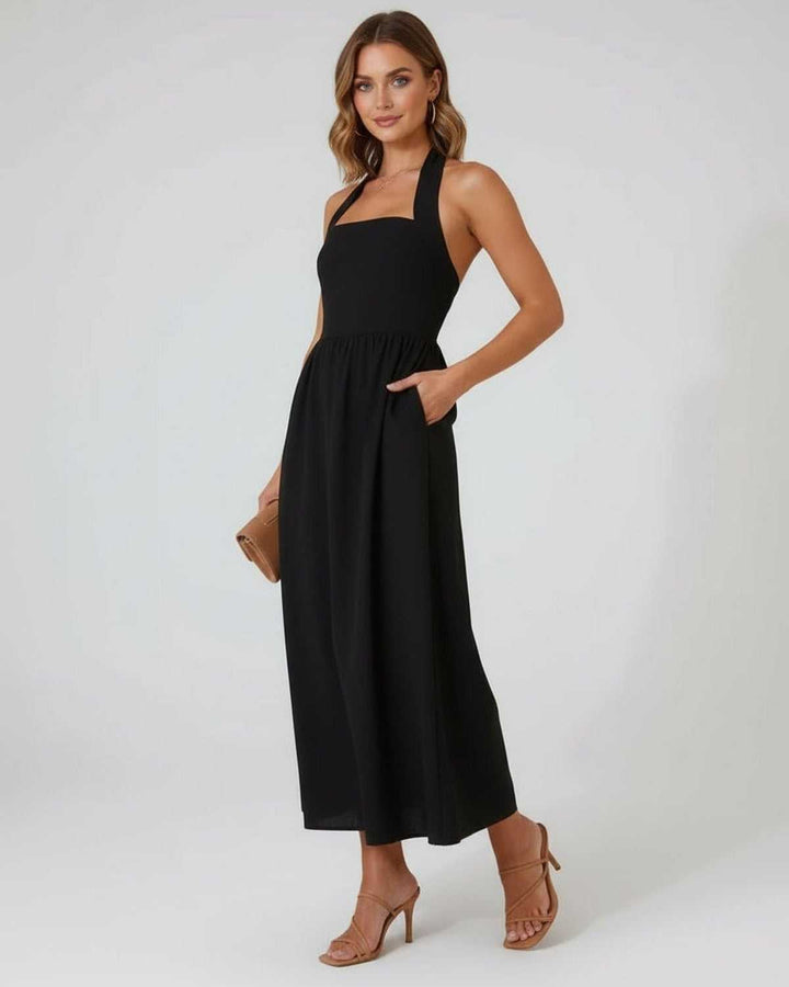 Moderno vestido midi negro halter para mujer, con silueta A-line, elegante y versátil para tu armario.