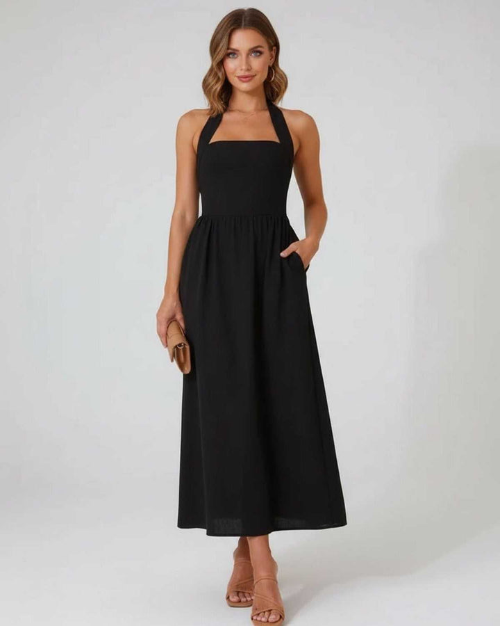 Vestido midi negro halter de mujer, elegante y versátil, perfecto para cualquier ocasión especial.