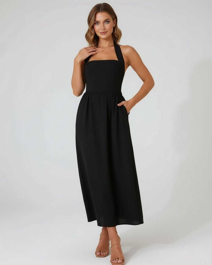 Vestido negro midi halter casual y elegante, una prenda esencial de moda femenina para el día y la noche.