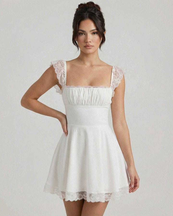 Vestido mini blanco A-line con corsé estructurado y escote cuadrado, ideal para fiestas y eventos de verano.