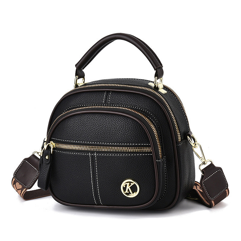 Bolso de mano cruzado para mujeres, diseño compacto. Versátil para salir.