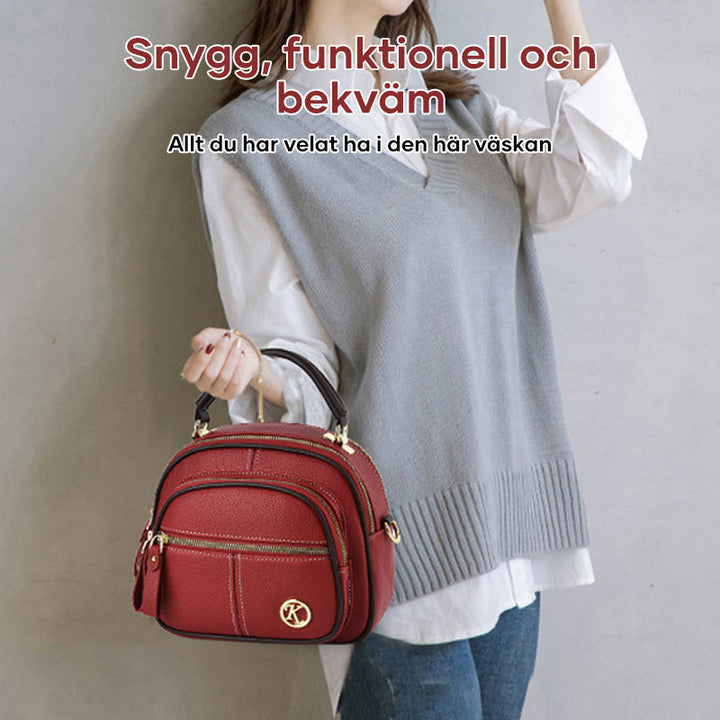 Bolso de mujer, estilo bandolera en piel sintética. Moda casual y duradera.