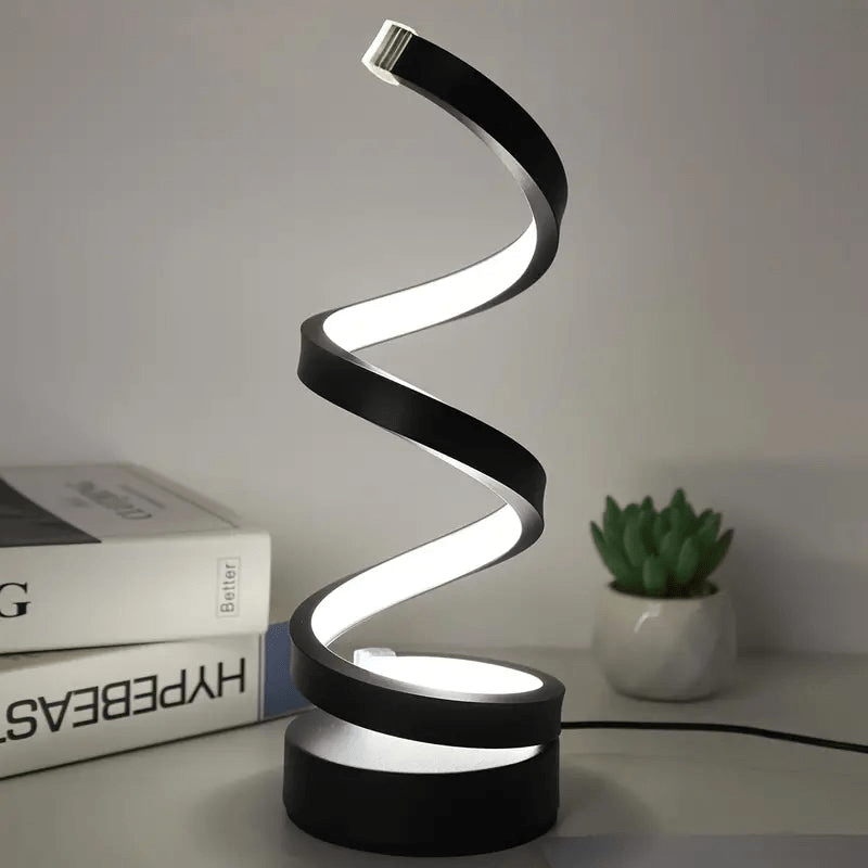 Lámpara de mesa LED espiral regulable de diseño moderno. Perfecta para iluminación ambiental en hogar u oficina.