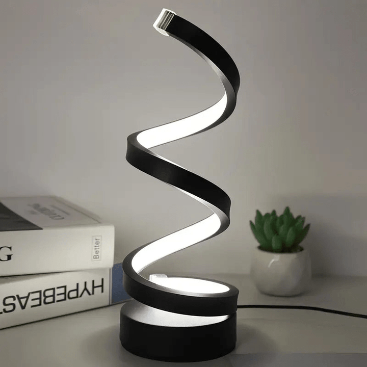 Lámpara de mesa LED espiral regulable de diseño moderno. Perfecta para iluminación ambiental en hogar u oficina.