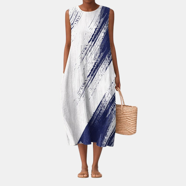 Vestido midi casual para mujer con estampado abstracto. Estilo sin mangas y corte fluido para máxima comodidad.