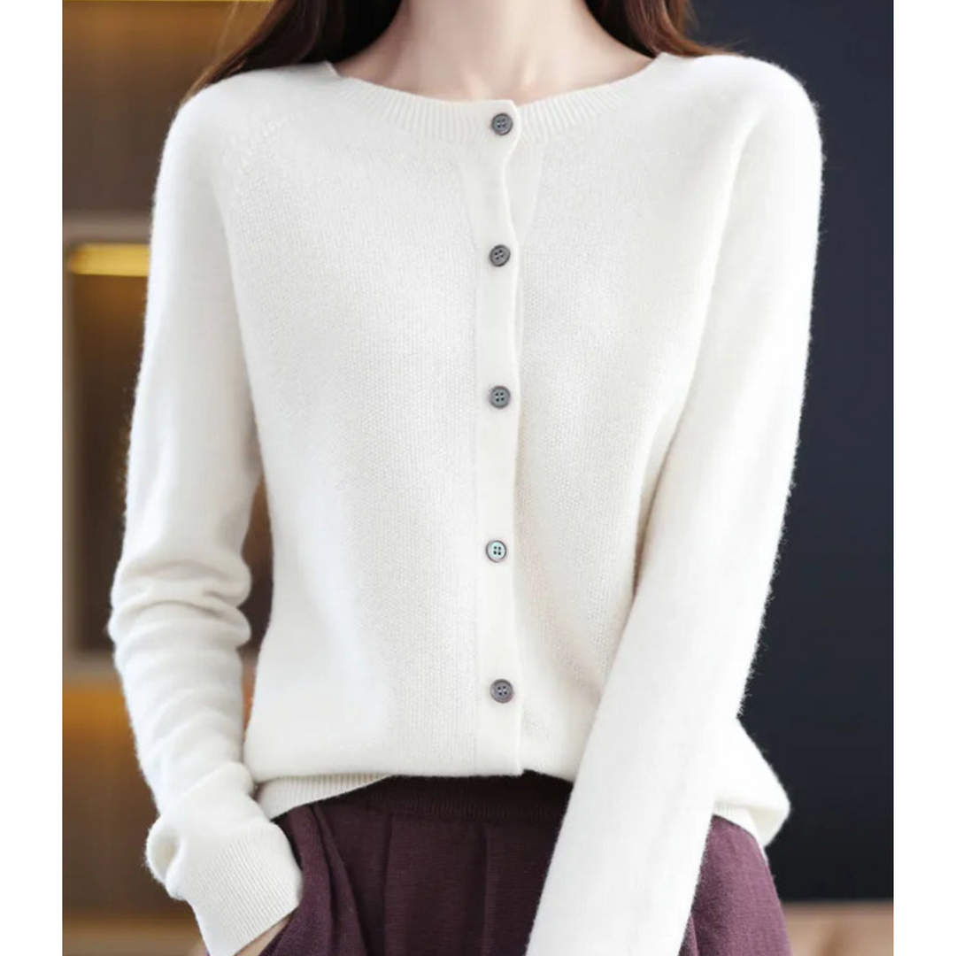 Abrigo ligero de punto para mujer, entallado. Botones, cuello redondo.