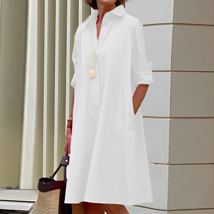 Vestido de mujer moderno y chic, cuello vuelto y manga tres cuartos. Moda casual elegante para cualquier día.