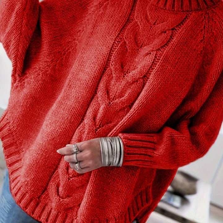 Punto trenzado y cuello alto en este jersey oversize de mujer, moda y confort para invierno.