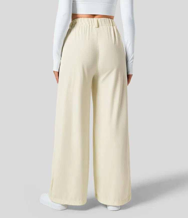 Pantalón casual elegante de talle alto para mujer, con pierna ancha y prácticos bolsillos. Ropa de confort.