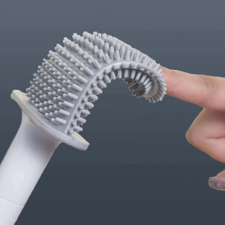 Accesorios de baño: escobilla de inodoro flexible con soporte de pared para una limpieza eficiente y ordenada.