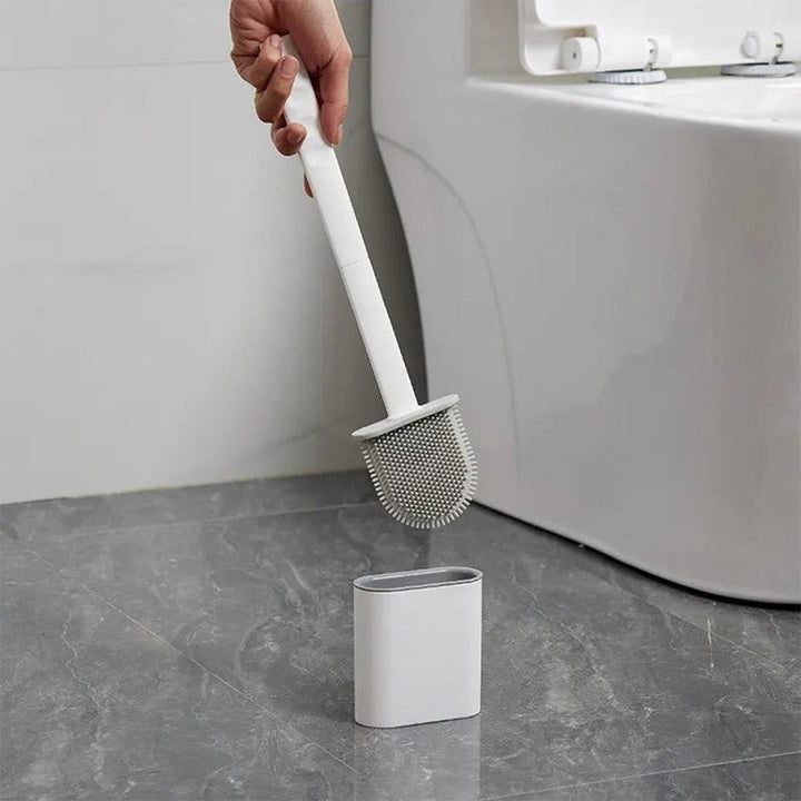 Escobilla de baño con cepillo flexible de silicona para fácil limpieza del inodoro y mayor higiene.