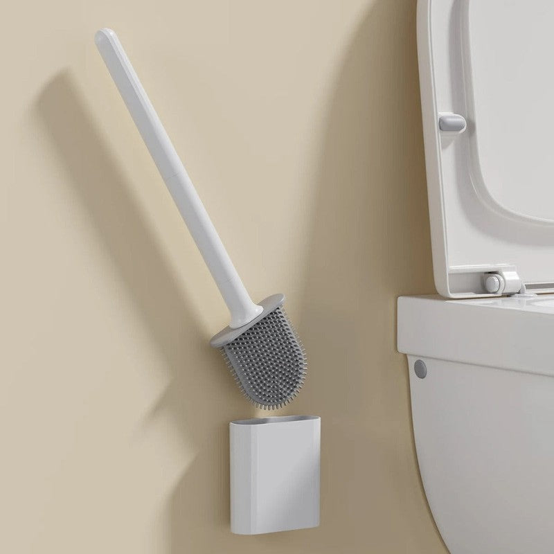 Organización del baño: escobilla de inodoro flexible con soporte de pared para mantener el área limpia y ordenada.