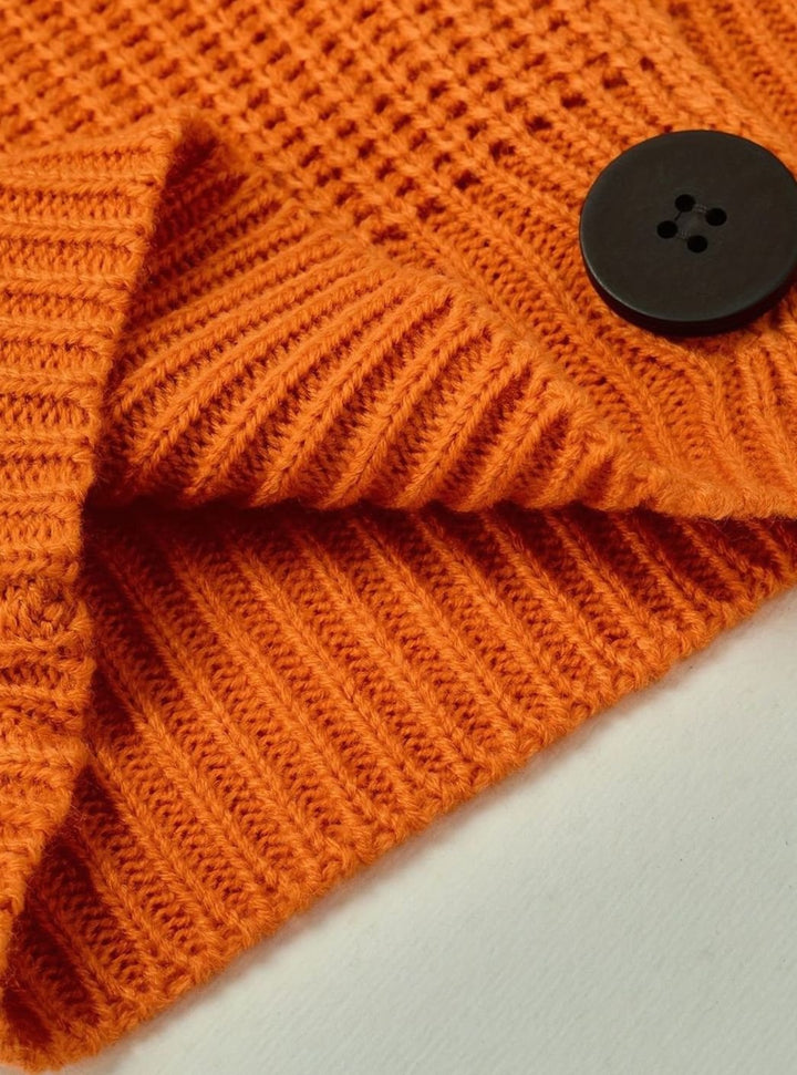 Modelo de jersey de punto canalé para mujer. Diseño con cuello solapa que aporta elegancia y confort.