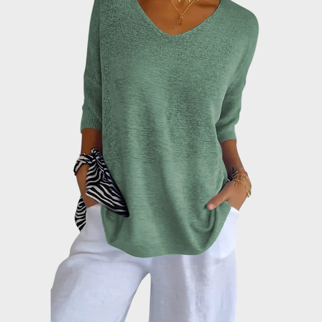 Jersey de mujer ligero y versátil con escote en V. Combina moda y comodidad para cualquier ocasión.
