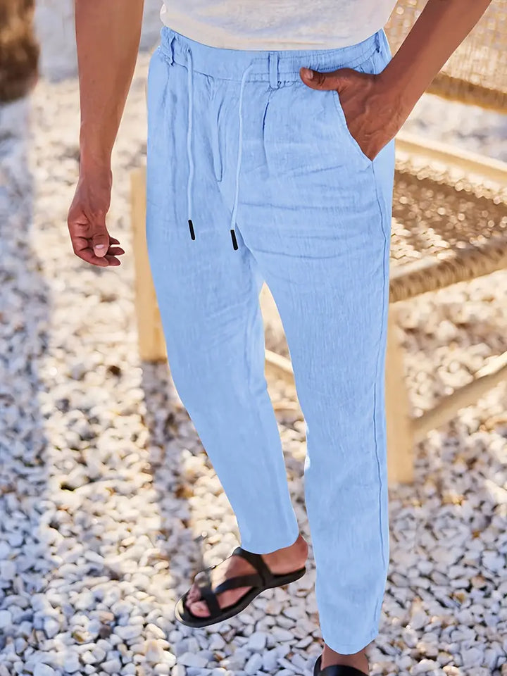 Pantalones de lino hombre, estilo relajado, largos y cómodos, con cordón para un ajuste casual.