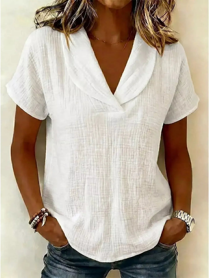 Blusa casual texturizada de manga corta para mujer, tallas grandes, ideal para verano y comodidad.