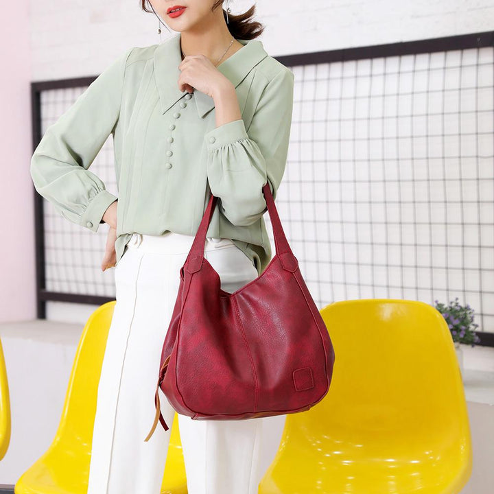 Bolso elegante de mujer, piel sintética, hombro, gran capacidad. Con compartimentos organizadores.