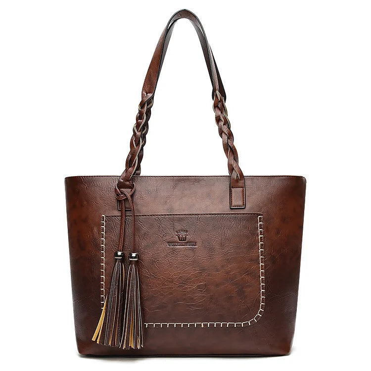 Bolso estructurado de cuero sintético, con detalles de alta calidad, durabilidad y un acabado impecable.