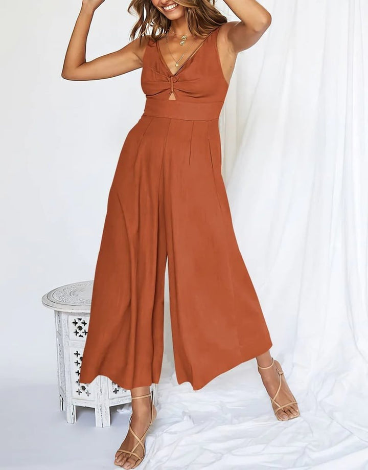 Mono de invitada versátil, corte pierna ancha, escote en V. Moda femenina sin mangas de verano.
