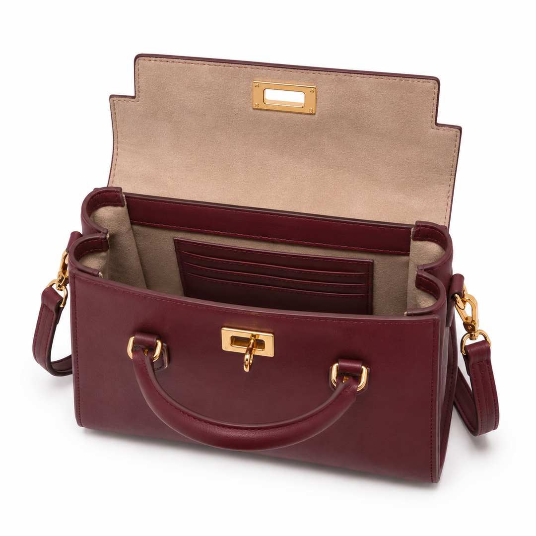Bolso de mano burdeos, cuero sintético, cierre metálico, asas. Estilo elegante para cualquier ocasión de mujer.