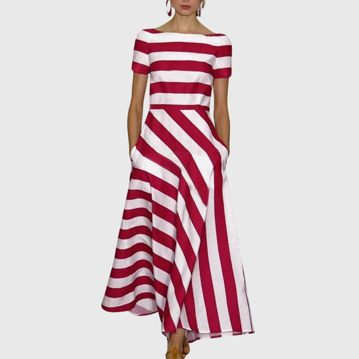Vestido maxi de mujer con rayas elegantes y diseño fluido, perfecto para verano casual o eventos. Moda cómoda y versátil.