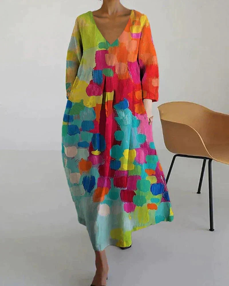 Vestido largo de mujer para boda, escote V. Estampado artístico vibrante, ideal invitada elegante, fiesta o graduación.