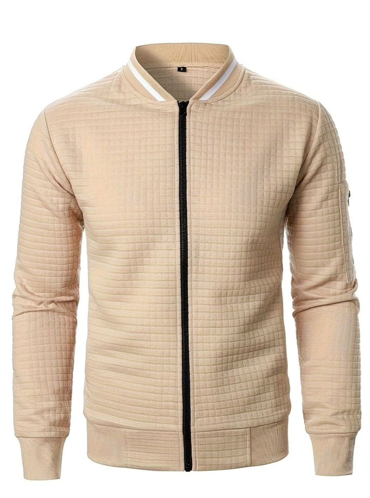 Cazadora bomber de hombre con textura de cuadros, ideal para entretiempo casual.