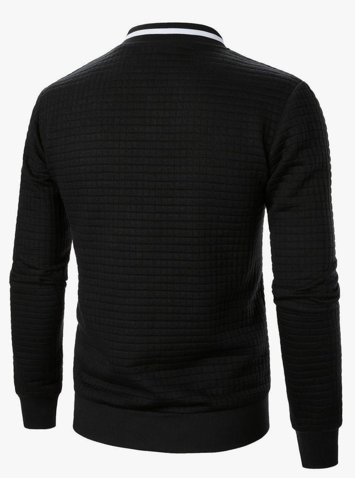 Bomber masculina con textura de cuadros, chaqueta de entretiempo, moda urbana.