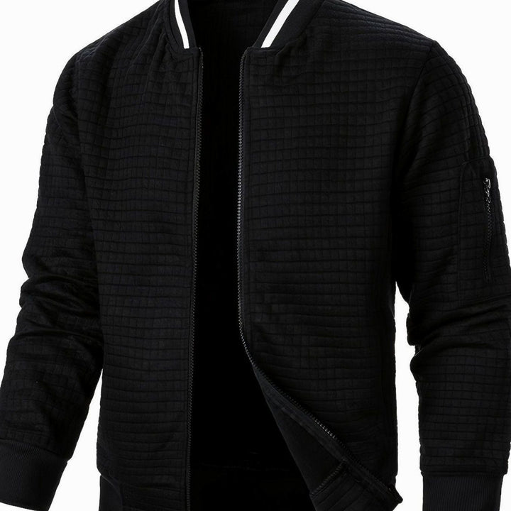 Cazadora urbana para hombre, bomber con textura de cuadros y cierre de cremallera.