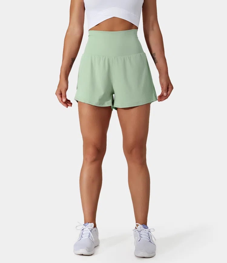 Short de entrenamiento para mujer, cintura alta, bolsillos, tejido transpirable.