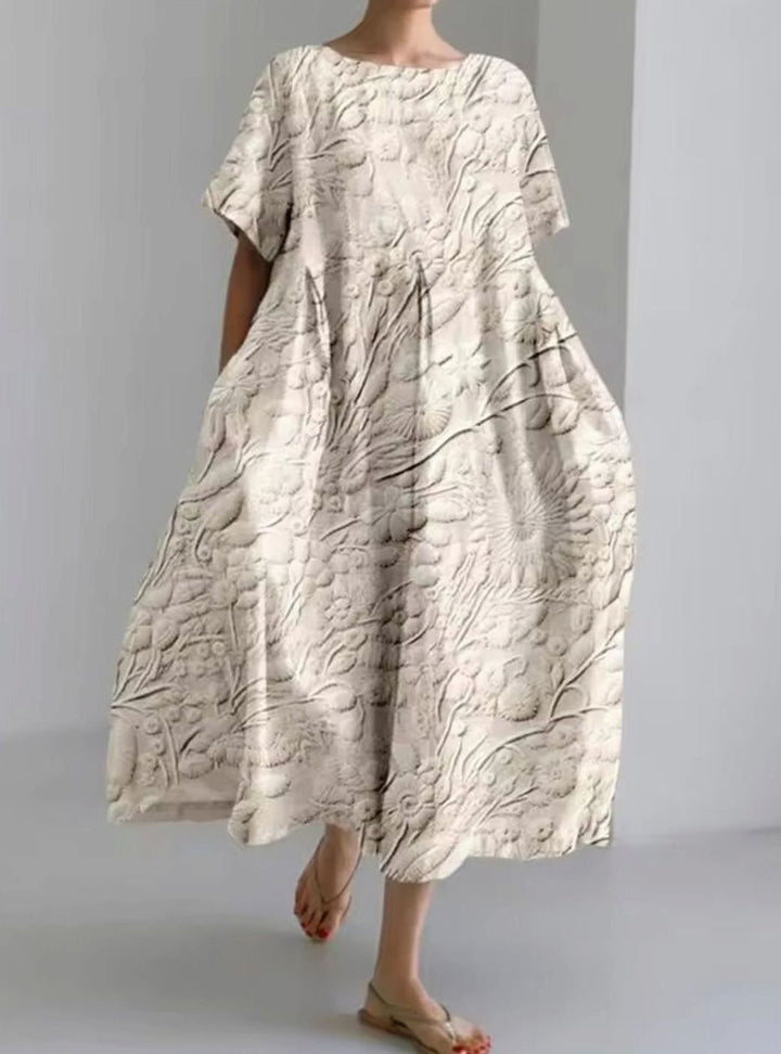 Vestido largo de mujer con cuello redondo y apliques florales. Perfecto para la moda de verano casual y elegante.