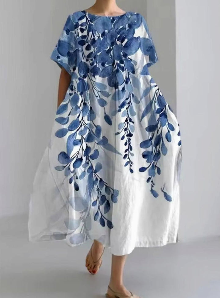 Vestido largo de mujer con estampado floral y apliques bordados. Cuello redondo, perfecto para eventos de día y noche.