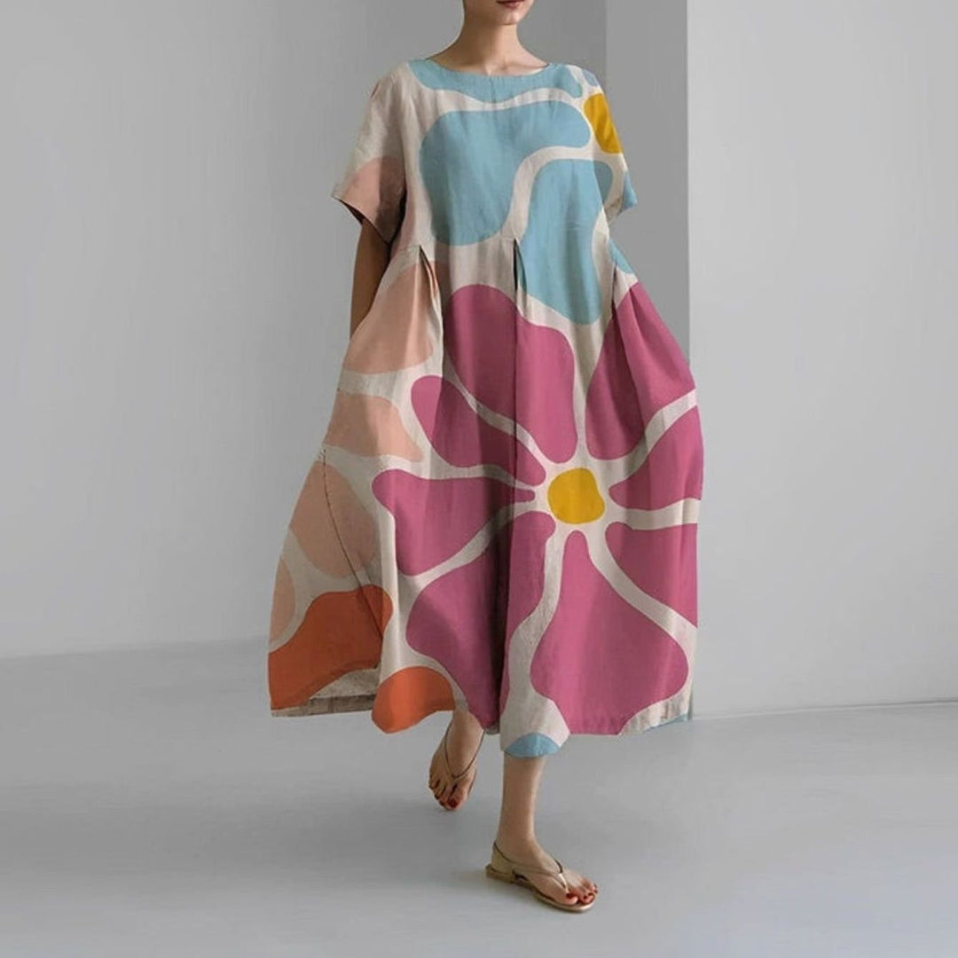Vestido floral midi casual de mujer para verano, diseño holgado y manga corta. Disponible en tallas grandes.