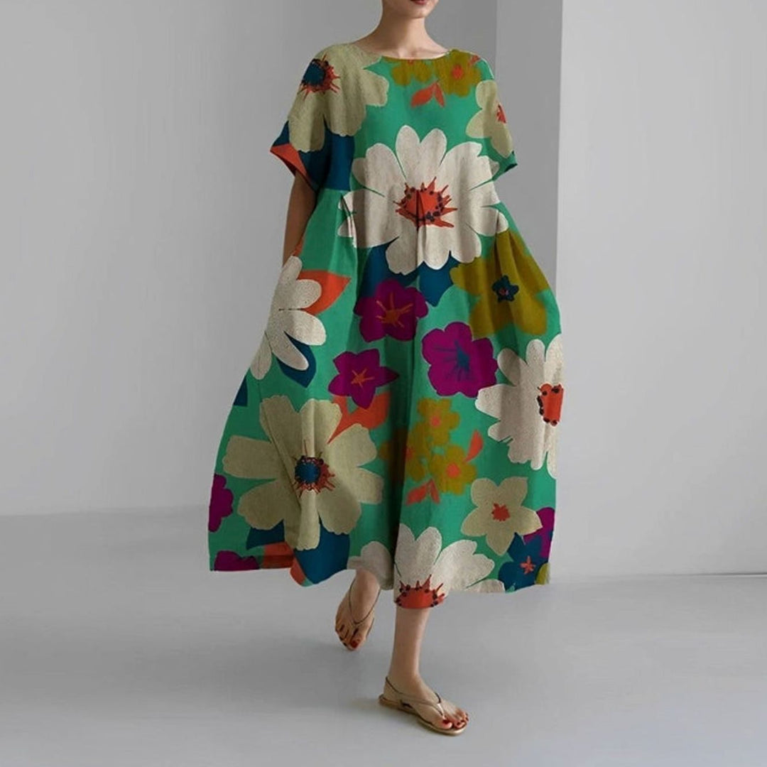 Elegante vestido midi floral para mujer, manga corta, silueta casual holgada con bolsillos.