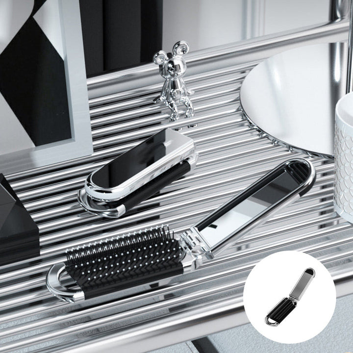 Cepillo de pelo y espejo plegable, perfecto para mantener tu estilo y apariencia en cualquier viaje.
