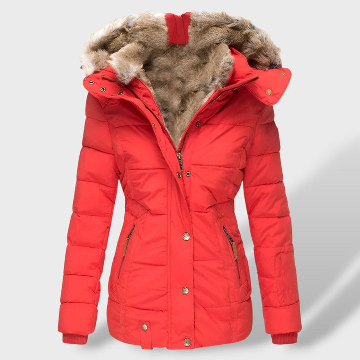 Detalle de la textura acolchada de la chaqueta para mujer. Material de alta calidad para máxima calidez.