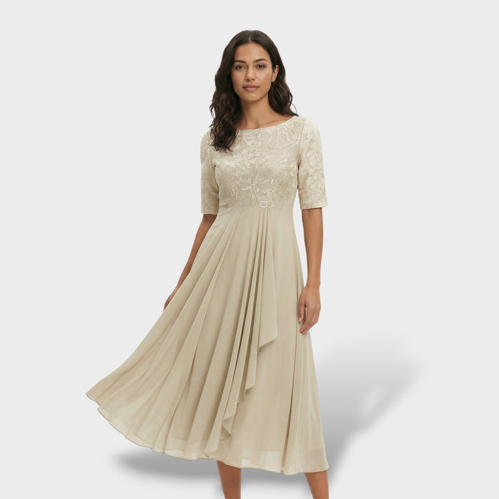 Elegante vestido midi de gasa y encaje, con caída fluida, ideal para bodas y fiestas.