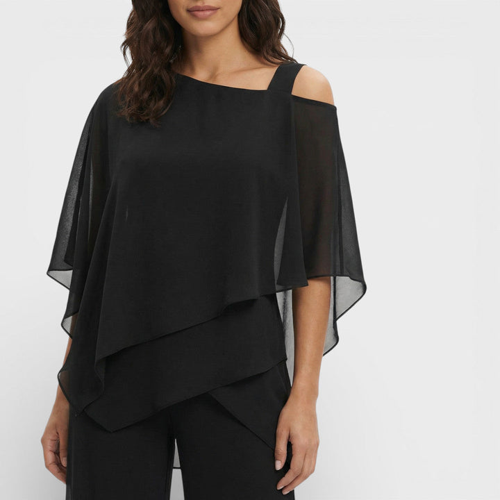 Outfit de blusa y pantalón elegante y moderno para mujer, ideal para celebraciones y fiestas.